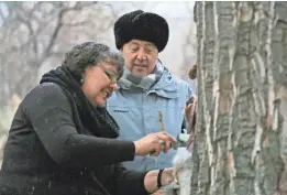  ?? TRAVEL CHANNEL ?? Donna Cossette skins a jackrabbit for a native Paiute meal along the Pony Express mail route for Andrew Zimmern on “Bizarre Foods.”