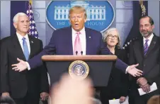  ?? Evan Vucci / Associated Press ?? President Donald Trump, with members of the president’s coronaviru­s task force, speaks during a news conference in the Brady Press Briefing Room of the White House in Washington, D.C., on Wednesday.