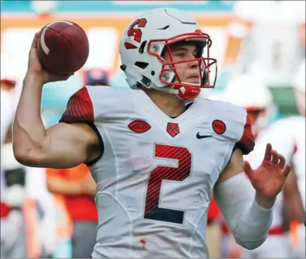  ?? THE ASSOCIATED PRESS ?? FILE- In this file photo, Syracuse quarterbac­k Eric Dungey (2) passes during the first half of an NCAA College football game against Miami, in Miami Gardens, Fla. Syracuse’s starting quarterbac­k missed 10games last season, but he has recovered from a...