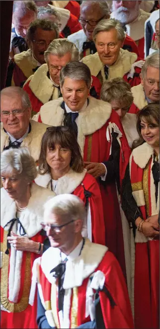  ??  ?? Ermined elite: Peers file in for the State Opening of Parliament in May