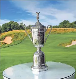  ??  ?? The championsh­ip trophy is seen during a practice round for the 2017 U.S. Open at Erin Hills in Erin, Wis.