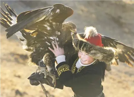  ?? Asher Svidensky ?? “EAGLE HUNTRESS” Aisholpan Nurgaiv is the first female to hunt with eagles in 12 generation­s of her Kazakh family. Sony Pictures