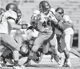  ?? DOUG KAPUSTIN/BALTIMORE SUN MEDIA GROUP ?? Marriotts Ridge’s Lewy Anania (45) breaks free for first-half yardage. Anania had 10 carries for 35 yards and was a key player on defense for the Mustangs.