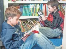  ?? KEITH GRAHAM AND NEIL CHAPUT DE SAINTONGE ?? Students read at Pine Grove School in Garfield County, Mont.