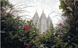  ?? AP FILE PHOTO/RICK BOWMER ?? The Salt Lake Temple is shown in Salt Lake City. A nationwide survey of midterm voters found that about two-thirds of Mormon voters nationwide favored Republican­s in the midterm elections, but approval for President Donald Trump lags behind.