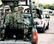  ?? MARCO UGARTE/AP ?? Soldiers ride in a truck Tuesday as they escort a caravan carrying Mexico’s defense minister in Tapachula, Mexico.