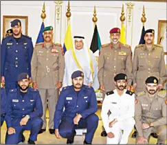  ??  ?? Deputy Prime Minister and Minister of Interior and Acting Defense Minister Retd. Lieutenant General Sheikh Khaled Al-Jarrah Al-Sabah with a new constellat­ion ofofficers.