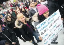  ??  ?? Ottawa march organizers, who said they wanted to send a clear message on human rights and Trump-style politics, were delighted with the turnout.
