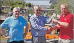  ??  ?? Joey Gough presents the cash to John Hill, right, and Billy Forteith of Oban lifeboat.