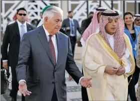  ?? AP/ALEX BRANDON ?? Secretary of State Rex Tillerson speaks with Saudi Foreign Minister Adel Ahmed Al-Jubeir after a news conference as Tillerson heads to his plane Sunday in Riyadh, Saudi Arabia.