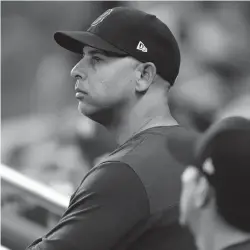  ?? JOHN BAZEMORE/AP ?? Red Sox manager Alex Cora looks on from the dugout against the Braves Tuesday in Atlanta. Cora has shaved the salt-and-pepper beard he grew prior to this season, hoping a new vibe might help Boston snap its season-worst five-game losing streak.