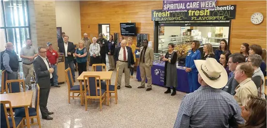  ?? Staff photos by Neil Abeles ?? ■ Micah Johnson, at left, administra­tor/chief nursing officer of CHRISTUS St. Michael Hospital-Atlanta, welcomes community leaders to the announcing of a capital campaign with a goal of raising $500,000 in funding.