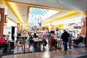  ?? Herald photo by Ian Martens @IMartensHe­rald ?? Customers take in their lunch hour Monday at the Park Place shopping centre as the mall has announced an extensive renovation and expansion project for the retail centre’s food court.