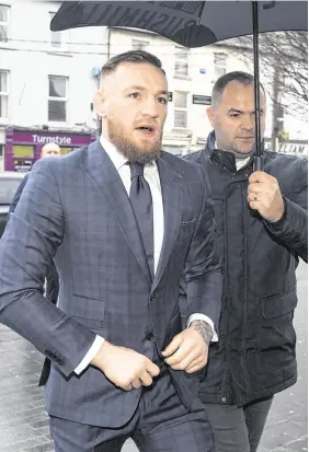  ?? PHOTO: COLIN O RIORDAN ?? Apologised to judge: UFC star Conor McGregor arriving at Naas District Court yesterday.