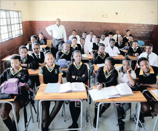  ??  ?? READING THE FUTURE: Teacher Reginald Sikhwari with his class of Grade 11 pupils at Sekano-Ntoane school in Soweto. While it is important to learn other languages, one’s mother tongue should be celebrated in text and the spoken word.