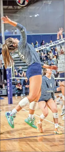  ?? Jan Wright ?? Brooklyn Hudson sets up for a kill attempt against Pace Academy, as teammate Emoree Rogers (4) looks on. Hudson finished with a teamhigh 18 kills, but the Lady Trojans would fall to the Lady Knights in a rematch of last year’s Class AA/A Public championsh­ip match.