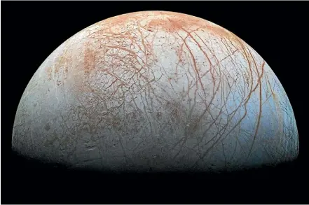  ?? NASA/JPL-CALTECH/SETI INSTITUTE ?? Jupiter’s moon Europa harbours a salt-water ocean beneath an icy crust.