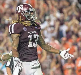  ?? JOHN GLASER/USA TODAY SPORTS ?? Texas A&amp;M wide receiver Kendrick Rogers celebrates after scoring the last TD in the fourth quarter in the 28-26 loss to Clemson.