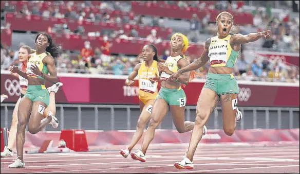  ?? GETTY IMAGES ?? Elaine Thompson-Herah (right) points to the clock even before crossing the finish line ahead of Shelly-Ann Fraser-Pryce (second from right) in the 100m final.