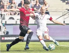  ??  ?? File photo shows Bayern Munich’s Dutch midfielder Arjen Robben (right) and Hanover’s Croatian defender Josip Elez vie for the ball during the German first division Bundesliga football match between Hannover 96 vs Bayern Munich in Hanover. — AFP photo