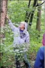  ??  ?? Camp Director Donna Wasser teaching tree identifica­tion.