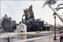  ?? PROVIDED BY CAPT. FRANK EANNOTTI OF STRATFORD POLICE ?? Firefighte­rs pour water on the remains of the former American Shakespear­e Theatre in Stratford. A fire early Sunday destroyed the structure.