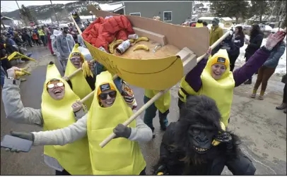  ?? CLIFF GRASSMICK — DAILY CAMERA ?? The Banana Hammock team shows off its coffin racer during the parade in Nederland in 2022.