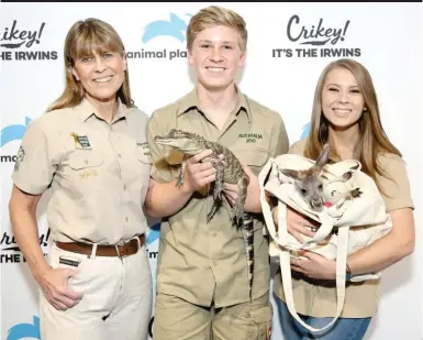  ?? MONICA SCHIPPER/GETTY IMAGES ?? Terri, Robert and Bindi Irwin star in “Crikey! It’s the Irwins.”