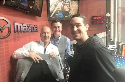  ?? ESPN 1000 ?? David Kaplan ( from left) and Pat Boyle of ESPN 1000 are joined by Cubs pitcher Kyle Hendricks in the station’s showcase studio on North State Street.