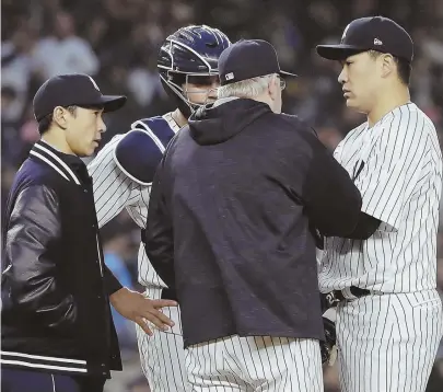  ?? AP PHOTOS ?? LOST IN TRANSLATIO­N? New York Yankees pitching coach Larry Rothschild, foreground, talks with, from right, pitcher Masahiro Tanaka (also pictured far left) and catcher Gary Sanchez, as translator Shingo Horie looks on during Tuesday night’s baseball...