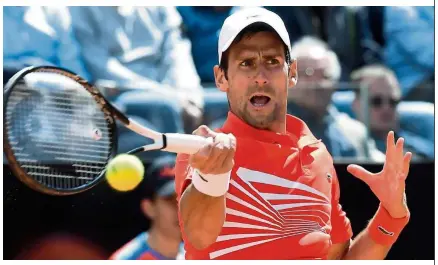  ?? — AFP ?? Going great guns: Serbia’s Novak Djokovic plays a forehand return to Canada’s Denis Shapovalov during their Italian Open third round match on Thursday.