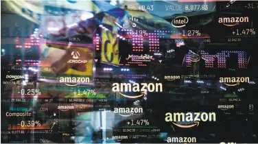  ?? Jeenah Moon / Bloomberg ?? A monitor displays Amazon.com stock informatio­n at the Nasdaq MarketSite in New York. Amazon briefly became the second trillion-dollar company after adding $434 billion to its market capitaliza­tion.