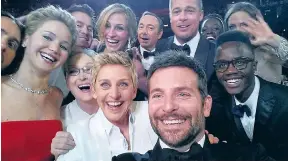  ??  ?? Stars pose in the famous 2014 Oscars selfie taken by Bradley Cooper, front