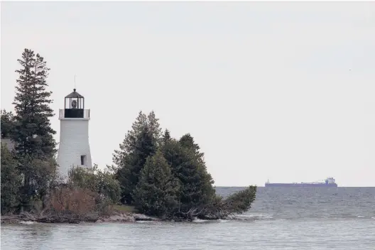  ?? KEVIN MIYAZAKI/THE NEW YORK TIMES PHOTOS ?? A lighthouse in the Thunder Bay National Marine Sanctuary.