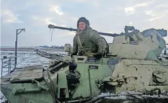  ?? | Reuters ?? A RUSSIAN soldier on an armoured personnel carrier during drills at the Kuzminsky range in the southern Rostov region, near Russia’s border with Ukraine this week.