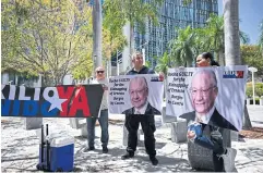  ?? ?? LIVING A LIE: People demand the ‘maximum sentence’ for former US ambassador to Bolivia, Victor Manuel Rocha, in Miami, Florida on Friday.
