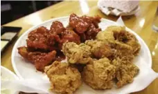  ??  ?? Southern foods such as fried chicken have made lasting impression­s.