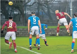  ?? ?? Jordon Forster (No. 6) bullets home a header for Kelty’s second goal