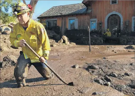  ?? Photograph­s by Wally Skalij Los Angeles Times ?? AN ESTIMATED 15% of residents in the mandatory evacuation zone left the area. Above, firefighte­r Alex Jimenez after the mudslide.