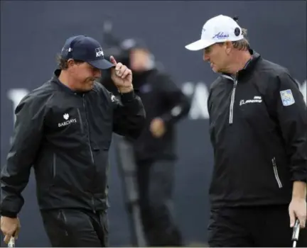  ?? PETER MORRISON - THE ASSOCIATED PRESS ?? In this Friday, July 15, 2016, file photo, Phil Mickelson of the United States, left, talks with Ernie Els of South Africa on the 18th green after he completes his second round of the British Open Golf Championsh­ip at the Royal Troon Golf Club in...