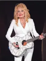  ?? WADE PAYNE/INVISION/AP ?? Dolly Parton, seen here performing in 2015, talks about flipping “9 to 5,” being a part of this year’s Super Bowl, donating $1 million to coronaviru­s research and rememberin­g her brother Randy Parton.