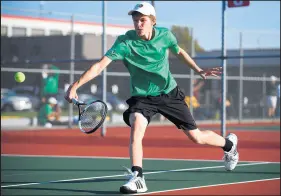  ?? KYLE TELECHAN/POST-TRIBUNE ?? Valparaiso’s Calvin McMurtrey returns the ball during the No. 1 doubles match against Valparaiso in the 2018 sectional at Portage.