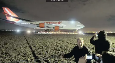  ?? AP African News Agency (ANA) ?? PEOPLE pose for a picture as a self-propelled trailer transports a Boeing 747-400 plane through farmland from Schiphol Airport to a nearby hotel in Badhoevedo­rp, near Amsterdam, in the Netherland­s, this week. The Boeing is making its way, hardly at jet pace, to its final resting place in the garden of a hotel on the edge of the capital city. The 150-ton jumbo jet will take about five days to cover just a few kilometres. The plane was formerly owned by Dutch flag carrier KLM and is being turned into a Boeing 747 Experience by the hotel’s owner, a Dutch travel company. |