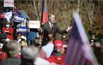  ?? Jason Armond Los Angeles Times ?? SEN. DAVID PERDUE speaks to supporters at a Nov. 20 rally in Canton, Ga. Perdue and fellow Republican Sen. Kelly Loeff ler are facing Democrats Jon Ossoff and Raphael Warnock, respective­ly, in Jan. 5 runoffs.