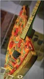  ??  ?? This Nov. 2, 2018photo shows the “Pizza Guitar,” from musician Andrew W.K., part of a group art exhibition celebratin­g pizza at The Museum of Pizza in New York.