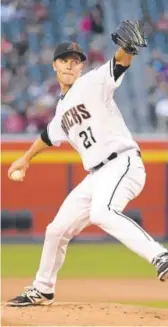  ??  ?? Zack Greinke is powering the Diamondbac­ks’ improved pitching, going 7-3. Ezra Shaw, Getty Images