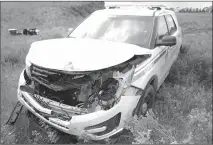  ?? Photo submitted by RCMP ?? An RCMP vehicle sits in a field after being damaged in pursuit Wednesday.