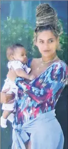  ??  ?? Royal cargo! Beyoncé totes adorable 5-month-old son Sir in mild Miami.