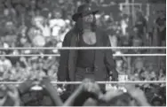  ??  ?? Undertaker gazes at the crowd after his Wrestleman­ia match on April 2, 2017, in Orlando, Fla. Phelan M.