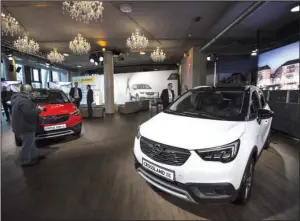  ?? Bloomberg News/ALEX KRAUS ?? Opel Crossland X sport utility vehicles are displayed Monday at a new-model release event in Frankfurt, Germany.